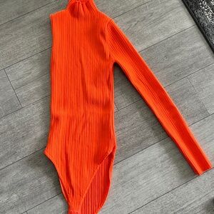 asymmetrical orange top